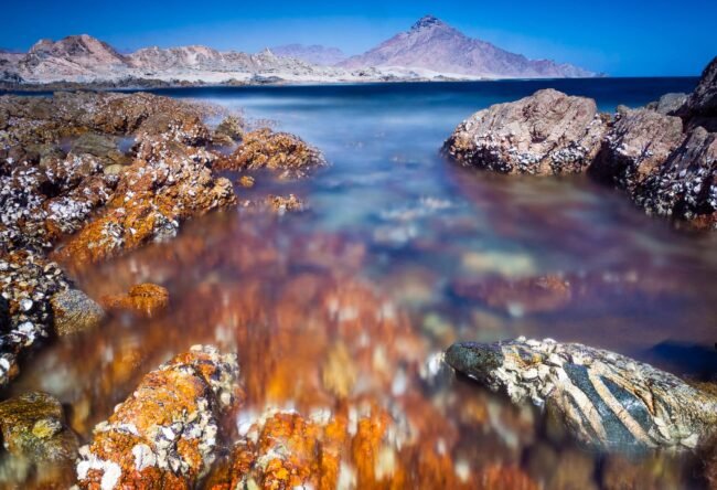 Seascape with red rocks, Oman